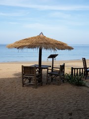 beach with chairs and umbrellas