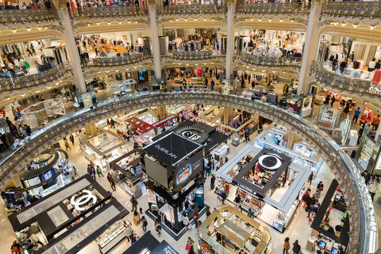 People shopping in luxury Lafayette department store of Paris, France