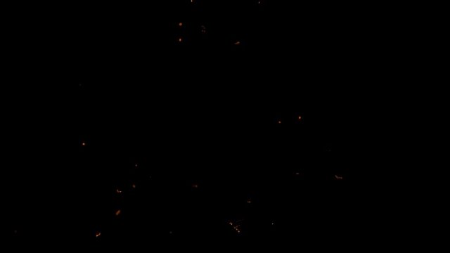 Slow motion sparks and burning particles falling down