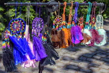 Fototapeta na wymiar Colorful dreamсatchers. Street trade in Souvenirs. Close-up.