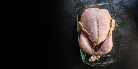 raw chicken in marinade (poultry, carcass meat) menu concept. food background. top view. copy space
