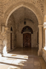 Fototapeta na wymiar Side entrance to the Franciscan monastery on the side of the Chapel of Saint Catherine in Bethlehem in Palestine