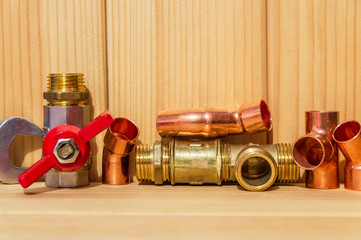 Spare parts and accessories for plumbing repair on wooden boards