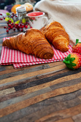 Delicious fresh croissant on table