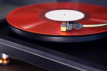 Vintage Stereo Turntable Plays Red Vinyl Record Album, Tonearm with Headshell