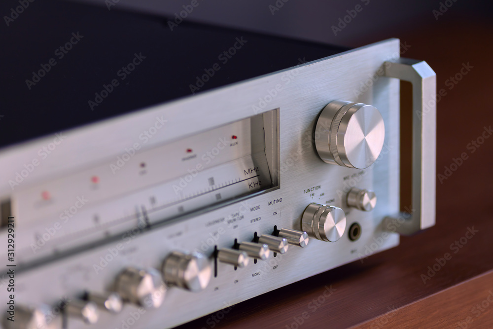 Wall mural Vintage Stereo Receiver Standing on the Wooden Sideboard, Side View