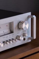 Fototapeta premium Vintage Stereo Receiver Front Panel with Controls Side View Closeup