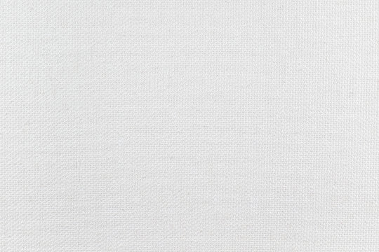 Close-up white canvas texture. Student grade blank painting canvas.