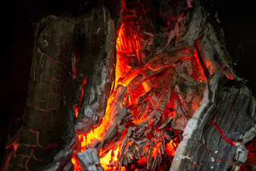 Hot burning coals in the fireplace.