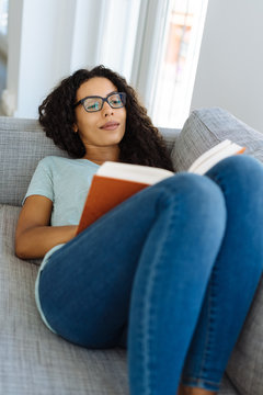 Young woman relaxing reading a good book