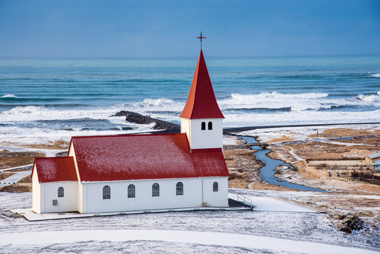 The Vik I Myrdal  church at the top of the hill offering picturesque images of the atlantic ocean and the village of vik in Iceland