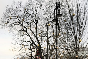 St. Petersburg, Russia, December 2019. Trees festively decorated with golden balls for Christmas in the city center.