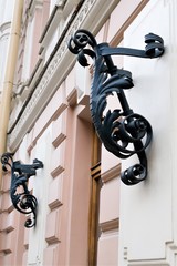St. Petersburg, Russia, December 2019. Torch mounts on the facade of an old building in the city center.