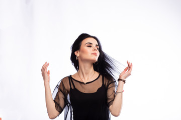 Fototapeta premium Young beautiful brunette girl on white background