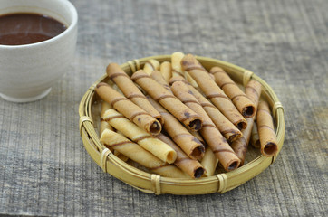 Chocolate waffle roll and vanilia waffle in bamboo basket