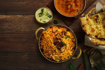 Indian meal / Restaurant menu concept - Mutton biryani, butter chicken, Roti