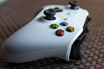 White game controller on textured surface