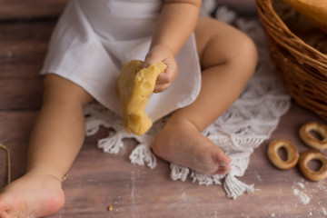 a child's hand in the flour