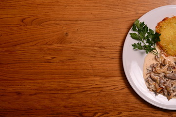 potato pie served with pork stew with mushrooms
