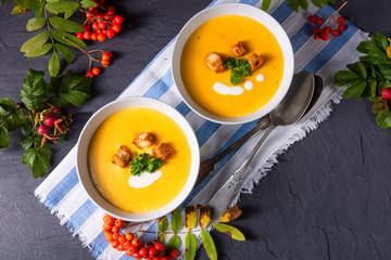 Delicious pumpkin soup with croutons and coconut milk