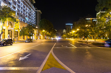 Central avenue with night illumination in the city of Baku.