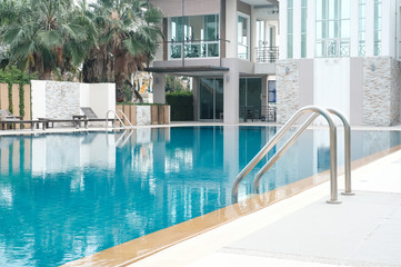 Closeup stair in the blue swimming pool background, Sport and healthy concept