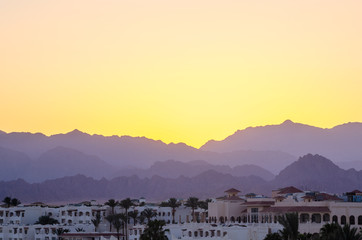 Fototapeta na wymiar Resort hotels against the backdrop of the mountains during sunset, Sharm El Sheikh, Egypt