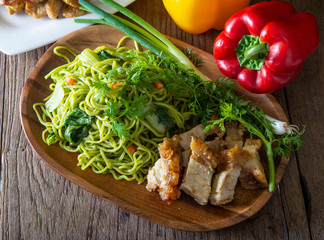 dry Chinese egg noodles topping crispy pork