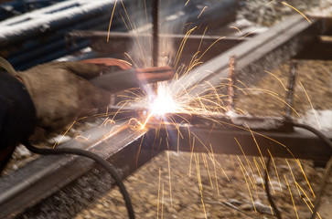 sparks from metal welding at a construction site