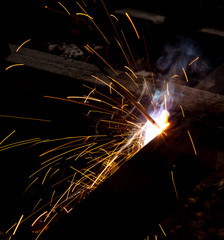 sparks from metal welding at a construction site
