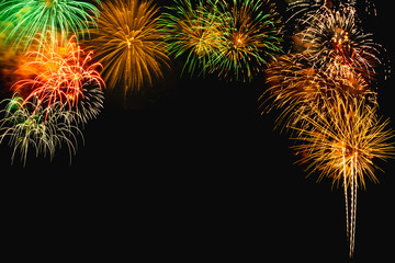 Fireworks colorful on black background at New Year with copy space