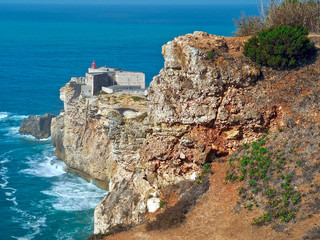 Fototapeta na wymiar Lighthouse in Nazare in Portugal