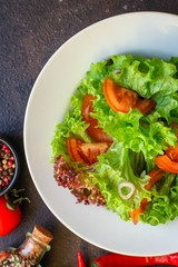 Healthy salad, leaves mix salad (mix micro greens, cucumber, tomato, chili pepper, other ingredients). food background. copy space