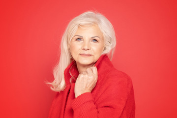 Senior lady in red fashionable clotes.