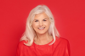 Senior lady in red fashionable clotes.