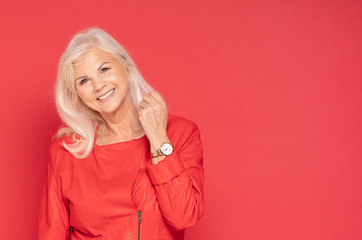 Senior lady in red fashionable clotes.