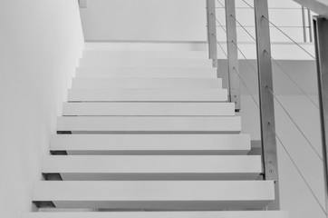 White wooden steps mounted in the wall