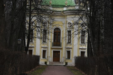 facade of an old building. yellow building fa&ccedil;ade. sculptures and decorative elements on the facade of buildings.