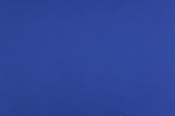 Sport Clothing Fabric Texture Background. Top View of Cloth Textile Surface. Blue Football Shirt With Copyspace.