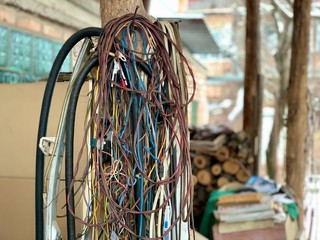 A bunch of old used electric wires. Wiring in the garage from an electrician. Multi-colored wires...