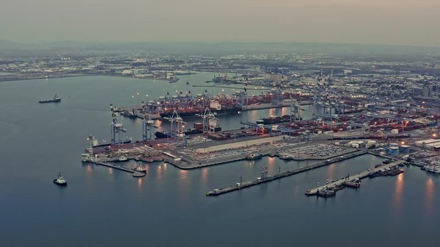 Containers loading in  industrial port (Haifa, Israel), 4k aerial drone view