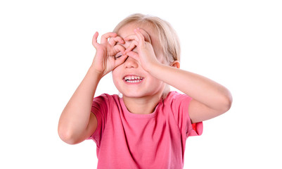 Close-up portrait of attractive cheerful humorous Little girl portrait showing binocular gesture.