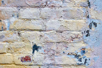 Loft damaged texture, wallpaper and background with painted red bricks and some color on it. Unusual design, decoration and exterior or interior details concept