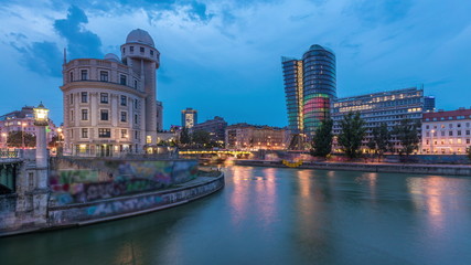 Naklejka premium Urania and Danube Canal day to night timelapse in Vienna.