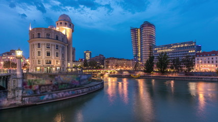 Obraz premium Urania and Danube Canal day to night timelapse in Vienna.