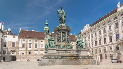 Fototapeta na wymiar Statue of Kaiser Franz Joseph I timelapse hyperlapse at the Hofburg Palace in Vienna.