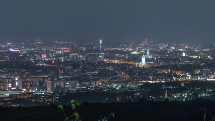 Skyline of Vienna from Danube Viewpoint Leopoldsberg aerial night timelapse.