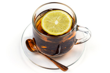 cup of hot tea with tea leaves and lemon is isolated on a white background	