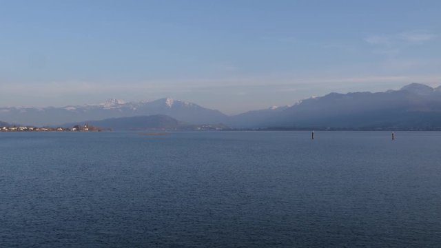 Tranquility silence at the waters of Seebad Rapperswil with distant mountains 