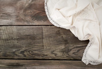 white kitchen textile towel folded on a gray wooden table from old boards